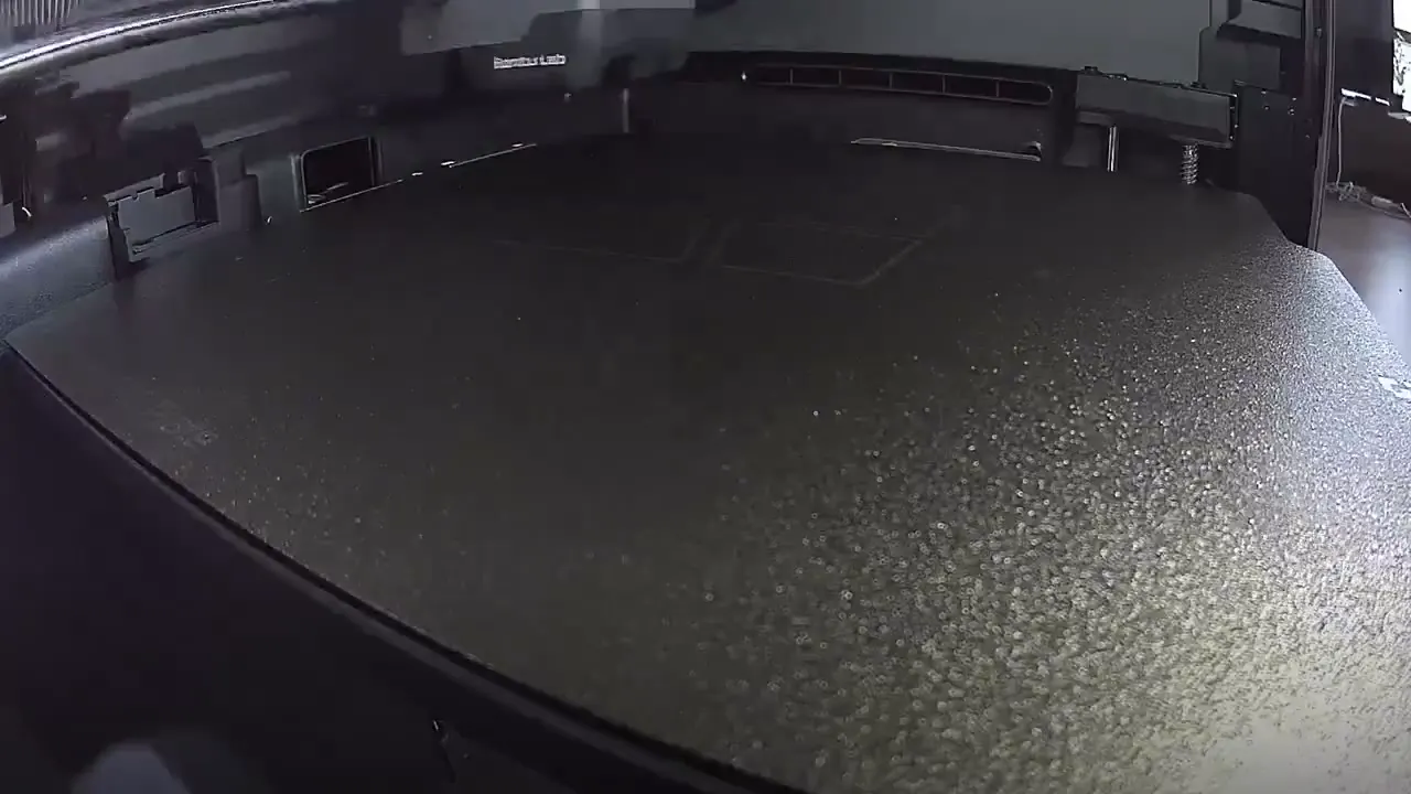 Frame from A 3D printer clears its build plate