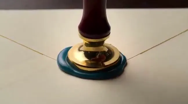 Frame from A koi pond inside a wax seal