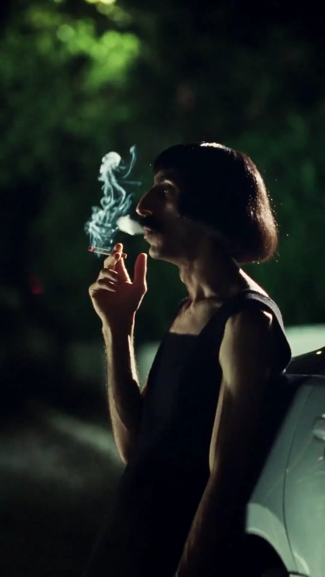 Frame from Black dress portraits in green light