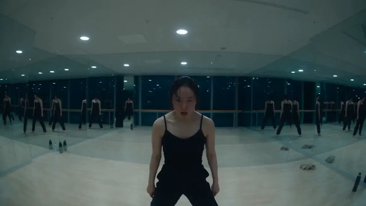 Frame from Dancer in a mirrored night studio