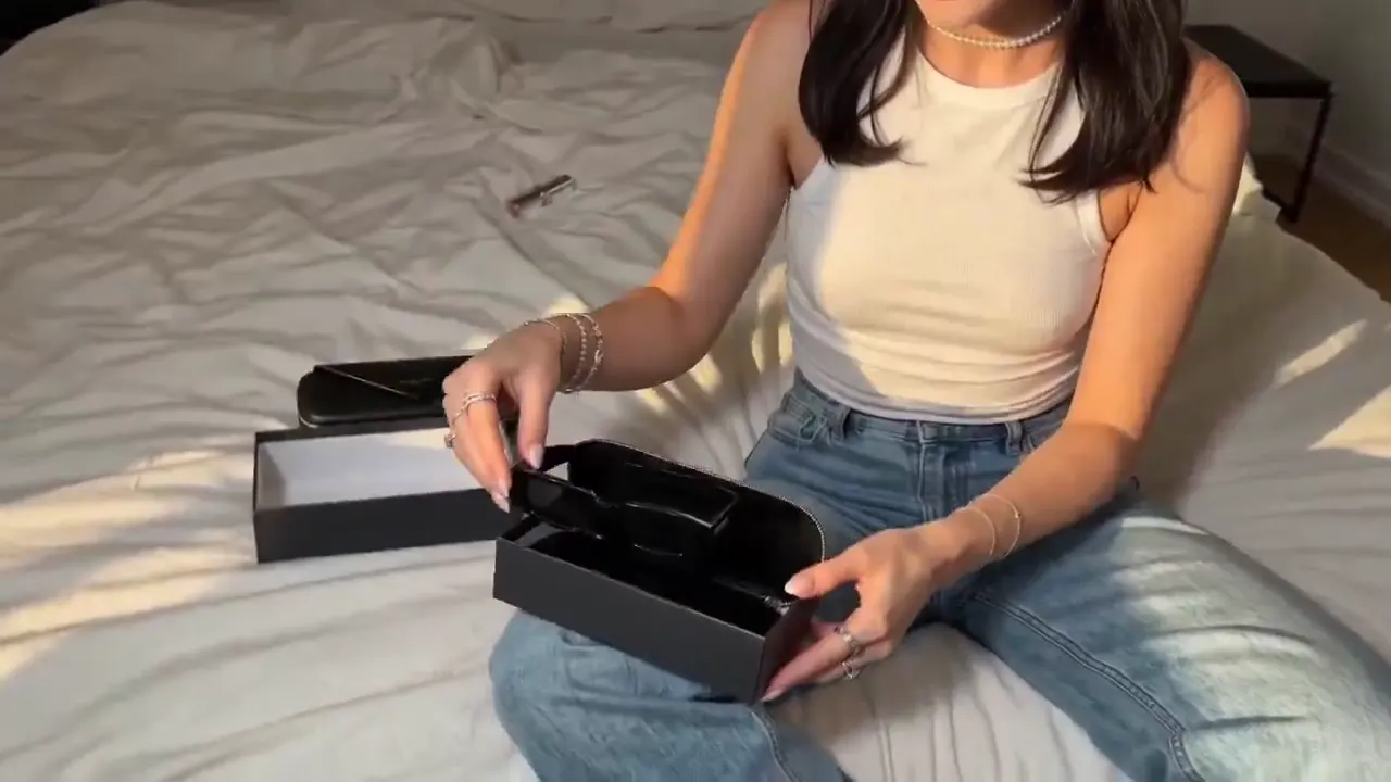 Frame from Sunglasses review in a sunlit bedroom